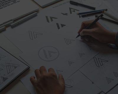 Graphic designer drawing sketch design creative Ideas draft Logo product trademark label brand artwork. Graphic designer studio Concept.